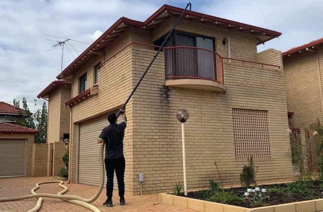 Two storey gutter clean with pole extension